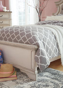 Realyn Upholstered Bed - Furniture Center (NY)