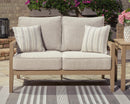 Hallow Creek Outdoor Loveseat with Cushion - Furniture Center (NY)