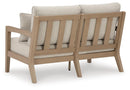 Hallow Creek Outdoor Loveseat with Cushion - Furniture Center (NY)